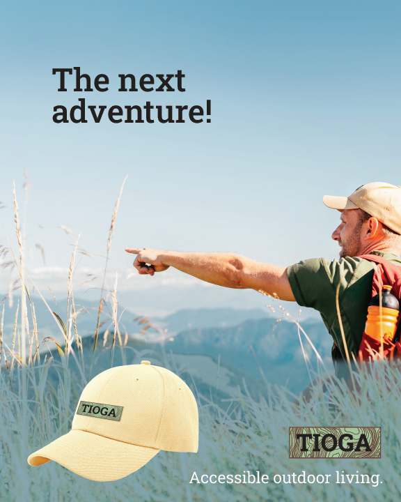 This magazine advertisement shows 
				a dude with camping gear, plus a sand-colored hat, pointing towards the 
				mountains in the distance. 
				
				The tagline at the top left reads: The next adventure! in a black, slab serif font.
				
				Towards the bottom 1/3rd part of this is a curved, greenish, but faded shape showing
				a larger image of the tan-colored hat, as well as Tioga's logo, and the tagline: 
				Accessible outdoor living